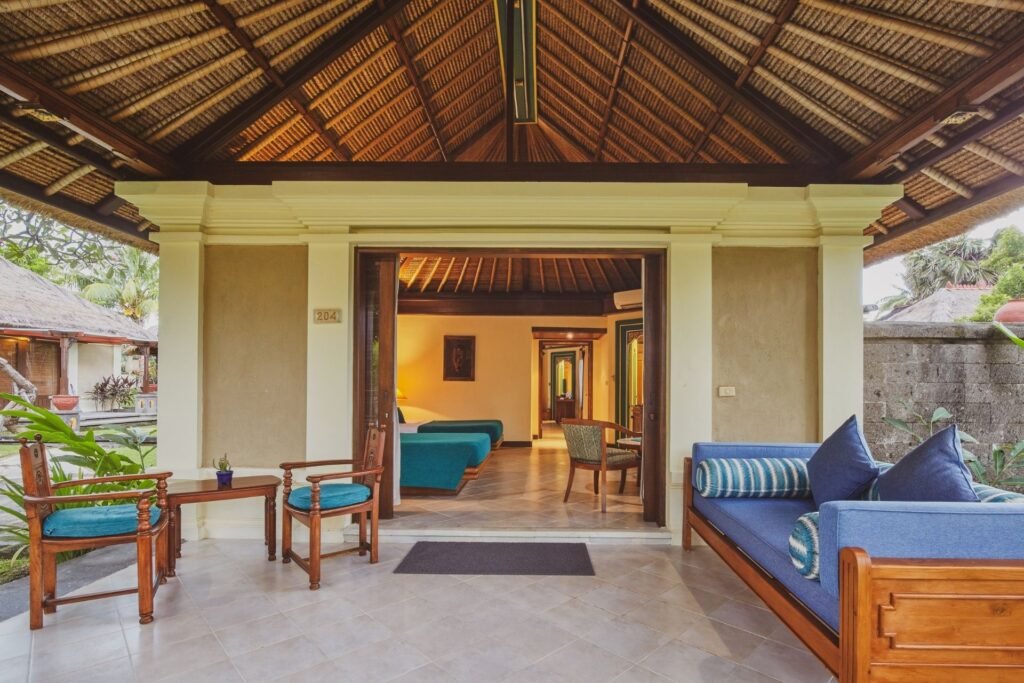 "Open view from terrace showing spacious interior of the deluxe garden room."