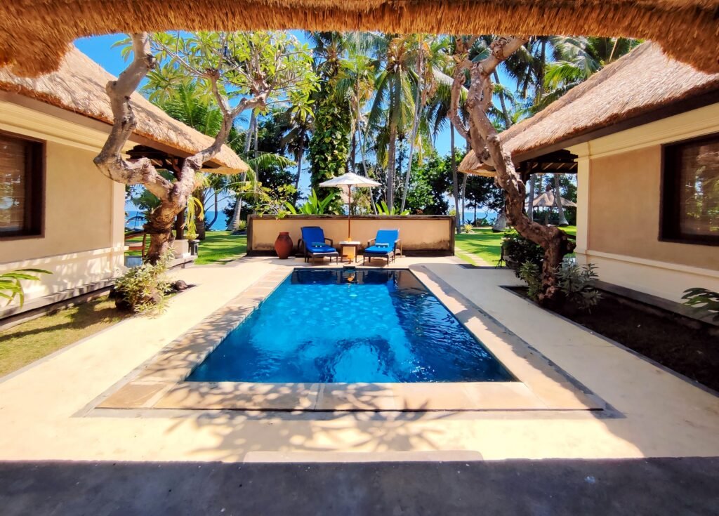 Private villa with a pool surrounded by tropical gardens and traditional Balinese architecture at Puri Bagus Lovina