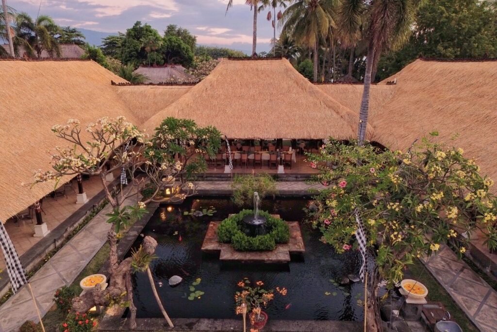 Aerial view of traditional Balinese architecture and garden at Puri Bagus Lovina