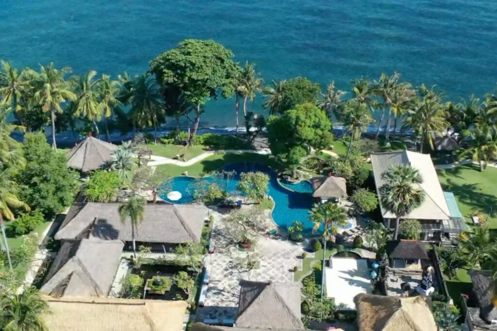 Aerial shot of Puri Bagus Lovina beachfront villas and swimming pool with ocean view